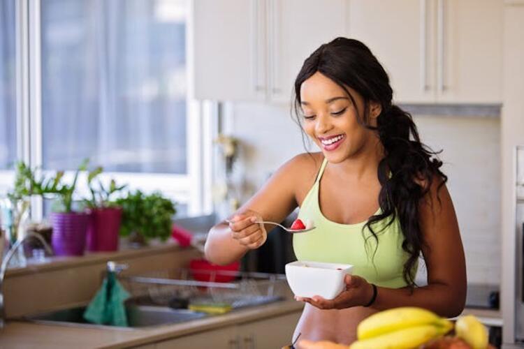 A woman holding a white bowl